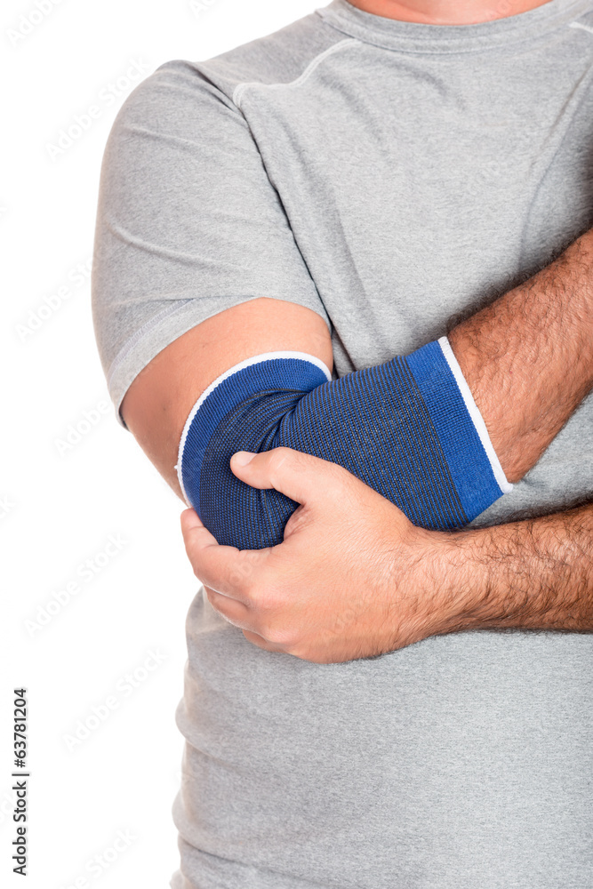 Obraz premium Man with a therapeutic elastic band on his elbow