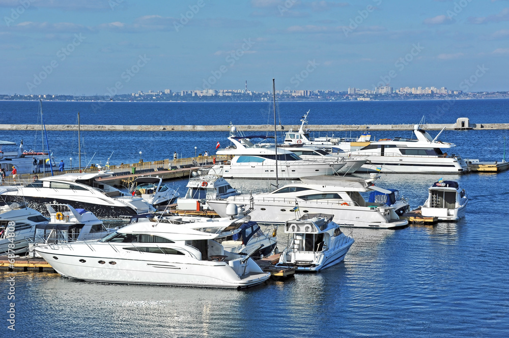 Fototapeta premium White motor yacht over harbor pier, Odessa, Ukraine