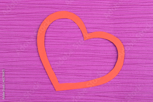 Paper heart on purple background