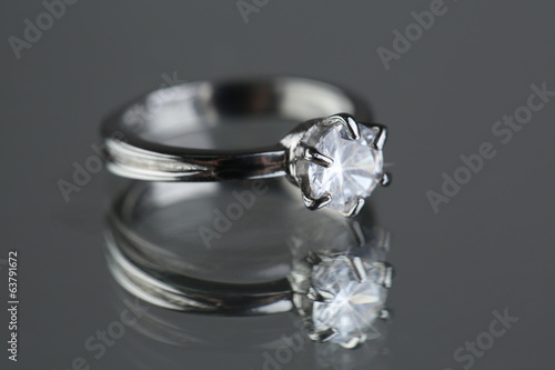 Beautiful diamond ring on gray background