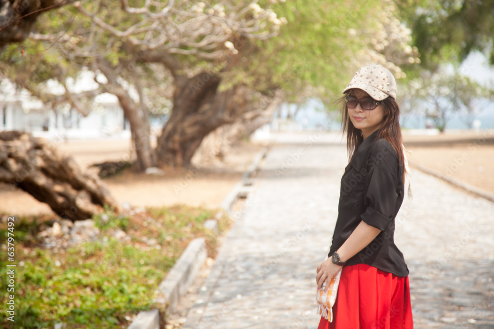 Asian women black shirt Standing on a walkway Asian women black shirt Standing on a walkway