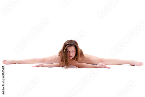 ductile flexible beautiful young woman sitting in split