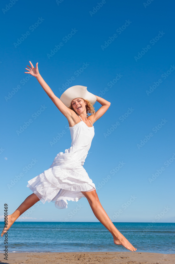 Young woman in white dress on the beach Young woman in white dress on the beach