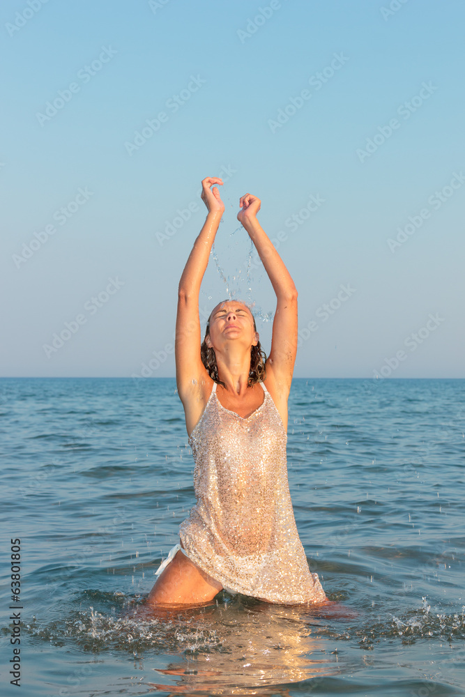 Woman on the beach in the evening Woman on the beach in the evening