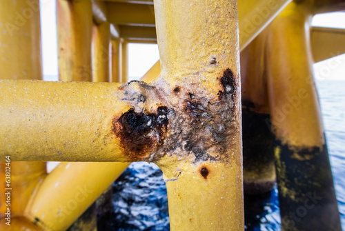 close up rusty form oil plantform photo