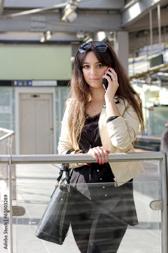 Fototapeta premium young student talking at the phone