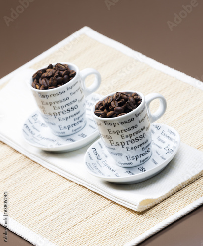 coffee cups full of coffee beans