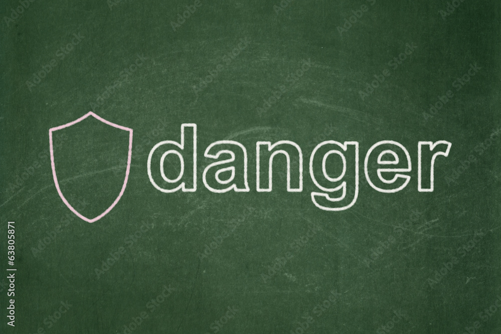Obraz premium Security concept: Shield and Danger on chalkboard background