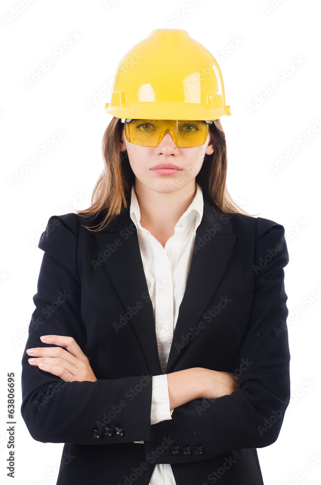 Pretty businesswoman with hard hat and in protective eyeglasses Pretty businesswoman with hard hat and in protective eyeglasses