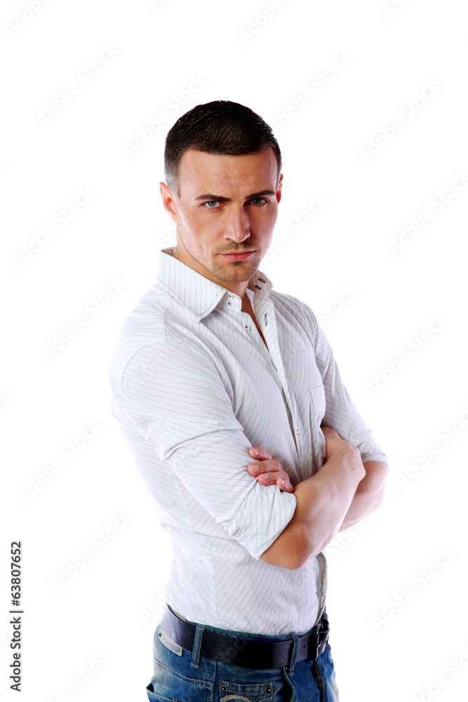 Portrait of a serious man with arms folded over white background Portrait of a serious man with arms folded over white background