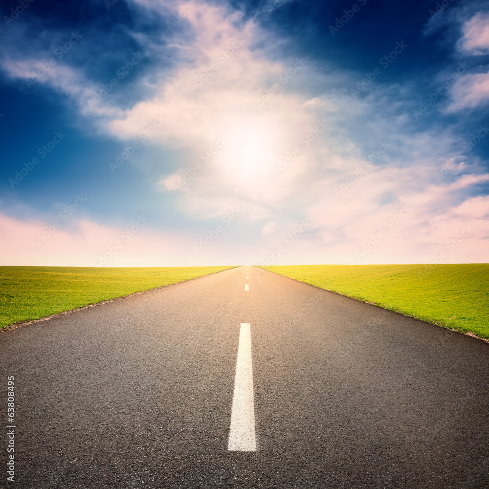 Driving on an empty asphalt road at sunny day