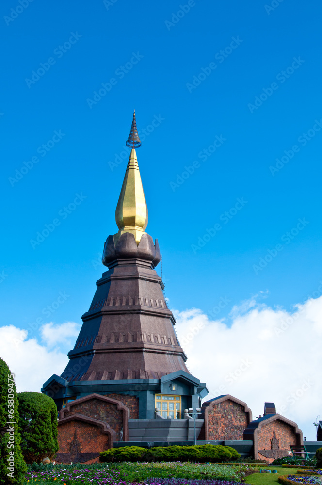Fototapeta premium The modern thai style pagoda with blue sky and garden in Thailan