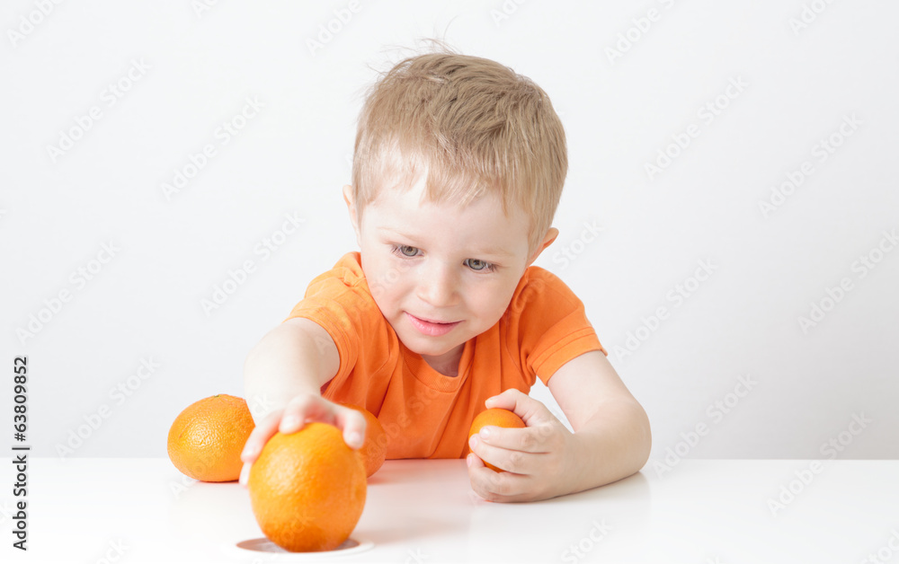 little boy with oranges, healthy food little boy with oranges, healthy food
