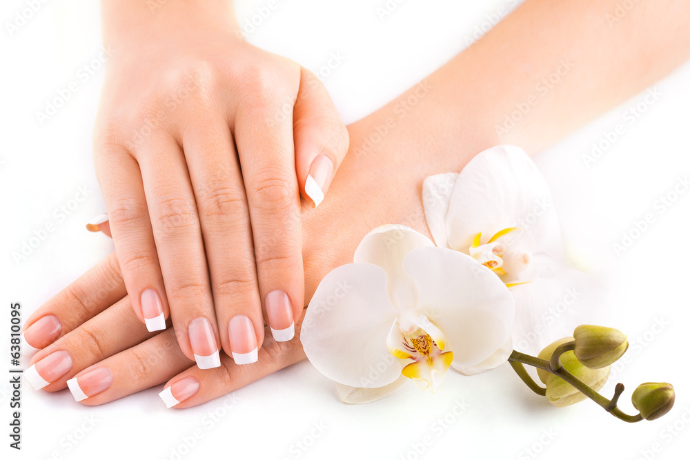 Naklejka premium beautiful french manicure with white orchid on white