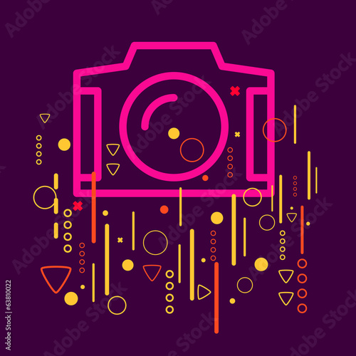 Photo camera on abstract colorful geometric dark background with
