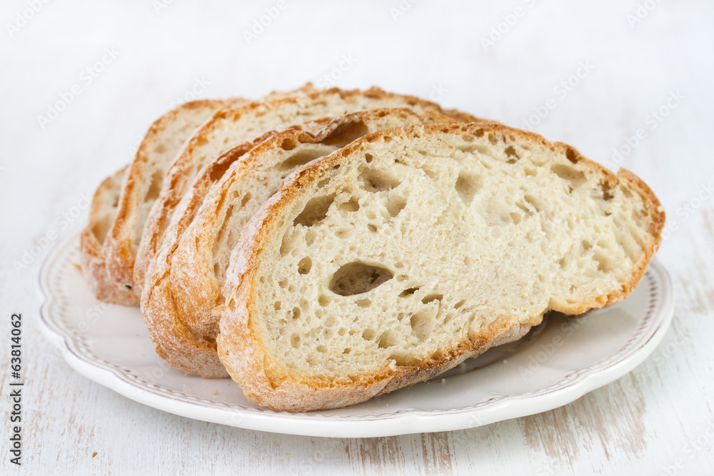 bread on white plate on white background bread on white plate on white background