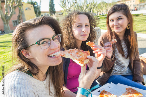 Girls Eating Pizza in the City