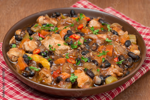 stew with black beans, chili, chicken and vegetables, close-up