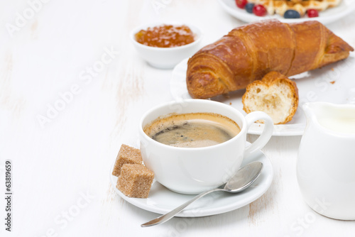 Fototapeta Naklejka Na Ścianę i Meble -  sweet breakfast with black coffee, croissants and orange jam