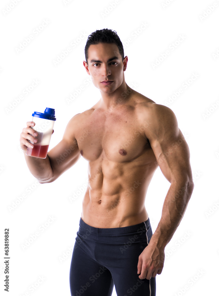 Muscular shirtless male bodybuilder holding protein shake bottle Muscular shirtless male bodybuilder holding protein shake bottle