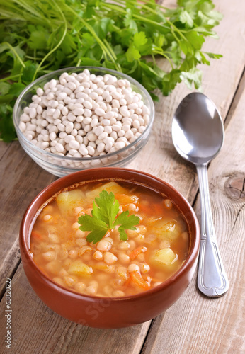Bean soup on wooden table