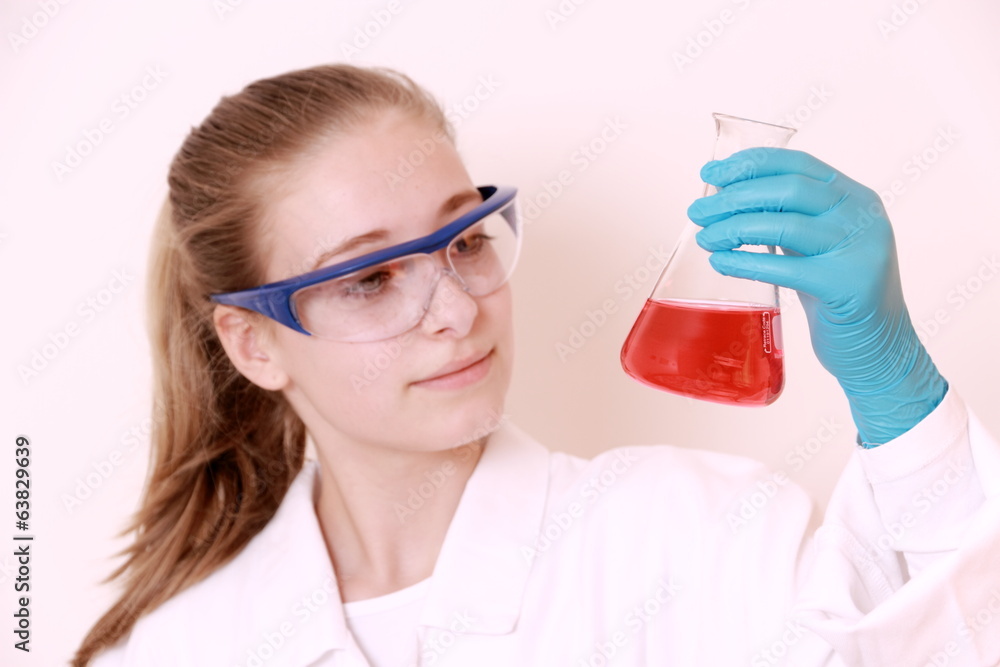 Girl student with conducting test beaker Stock Photo | Adobe Stock