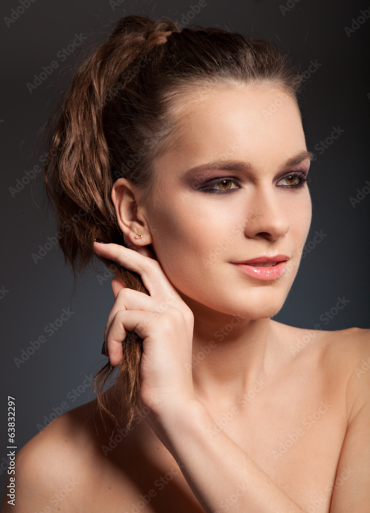 Portrait of beautiful sexy female model on dark background Portrait of beautiful sexy female model on dark background