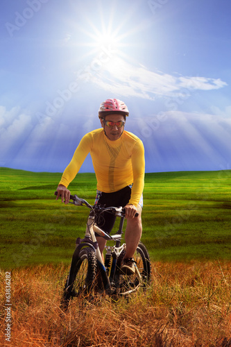 young man wearing yellow bicycle shirt riding mountain bike mtb
