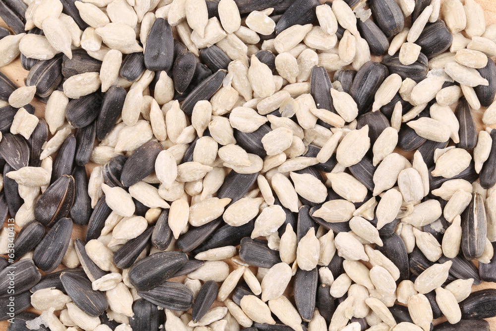 Sunflower seeds in shell and peeled. Sunflower seeds in shell and peeled.