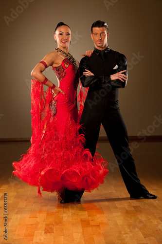  Professional ballroom dance couple preform an exhibition dance photo