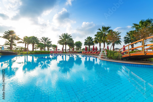 Sunrise at the tropical swimming pool