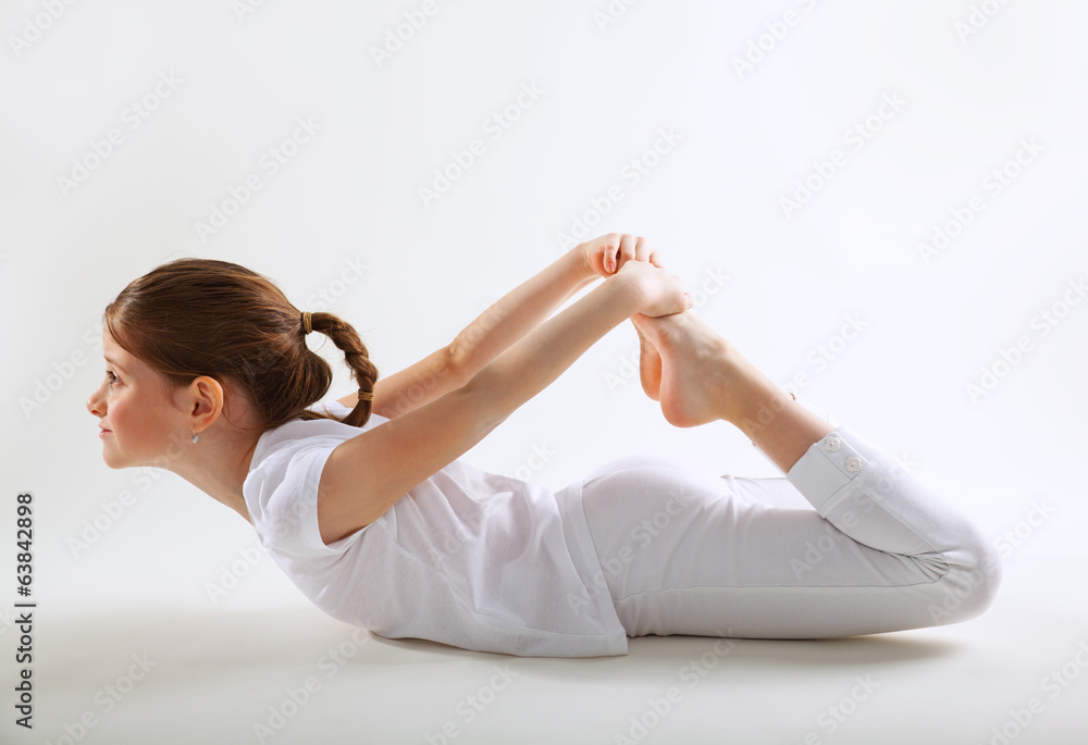 Fototapeta premium Young girl doing yoga