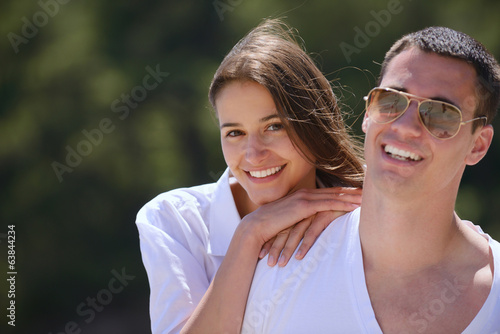 happy young couple have fun on beach