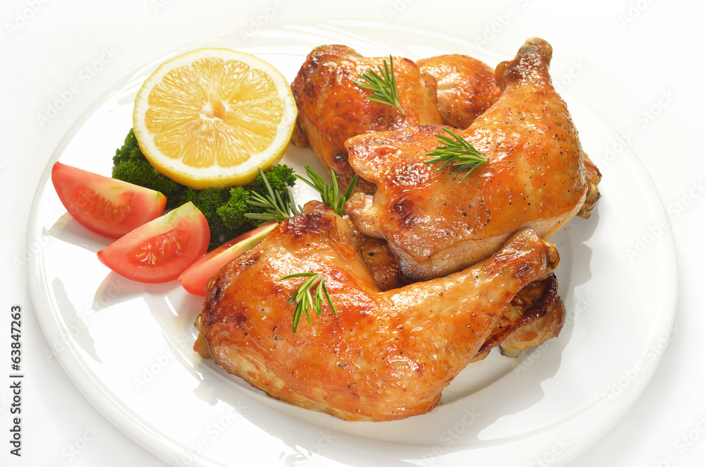 Grilled chicken thigh with vegetables on white plate. Grilled chicken thigh with vegetables on white plate.