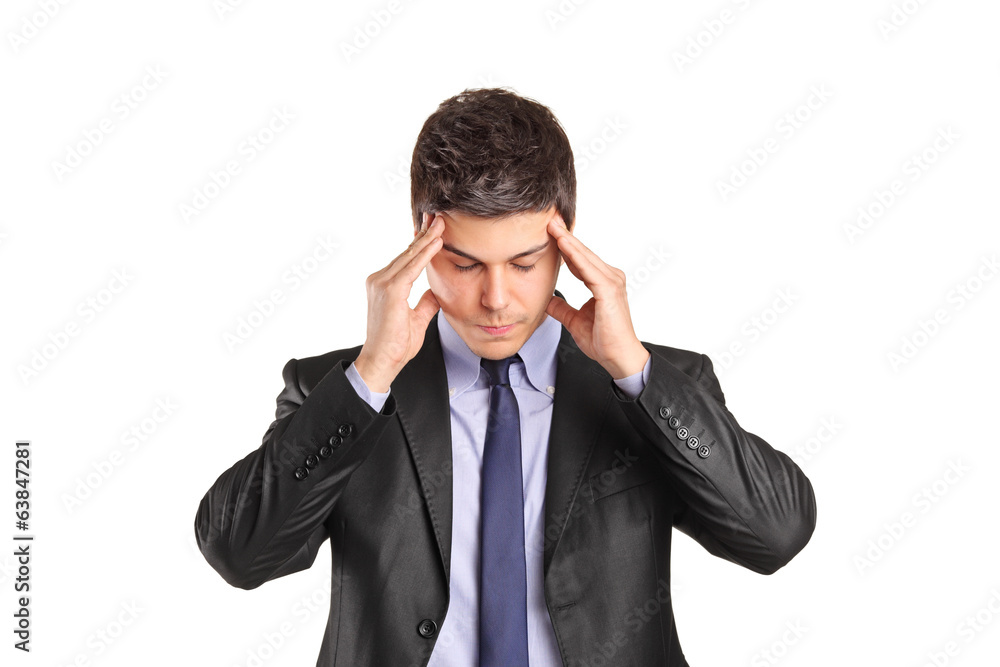 Young man in suit trying to concentrate Young man in suit trying to concentrate