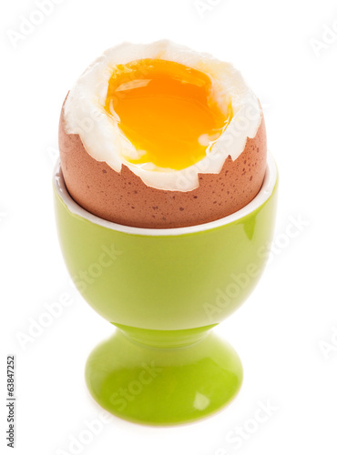 Vászonkép Light boiled egg in egg cup isolated on white