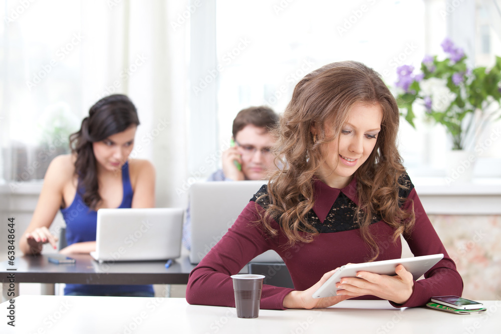 smiling young girl reading tablet smiling young girl reading tablet