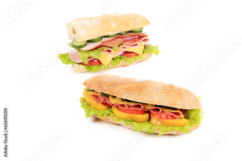 Sandwiches with ham, cheese and tomato.
