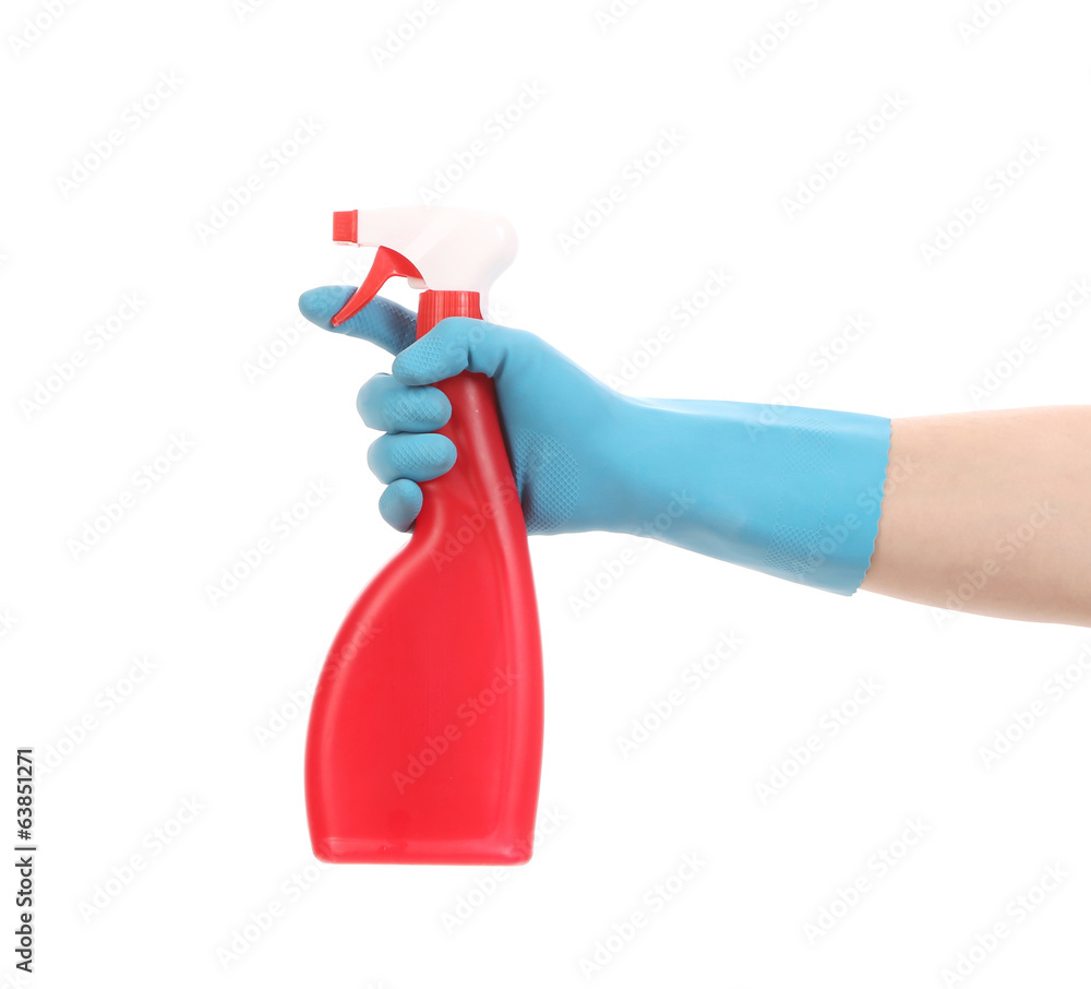 Hand in glove holding red plastic spray bottle. Hand in glove holding red plastic spray bottle.