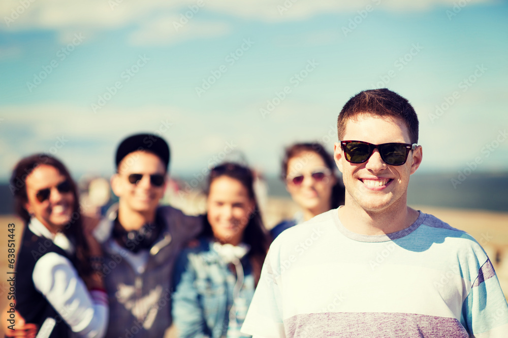 teenager in shades outside with friends teenager in shades outside with friends