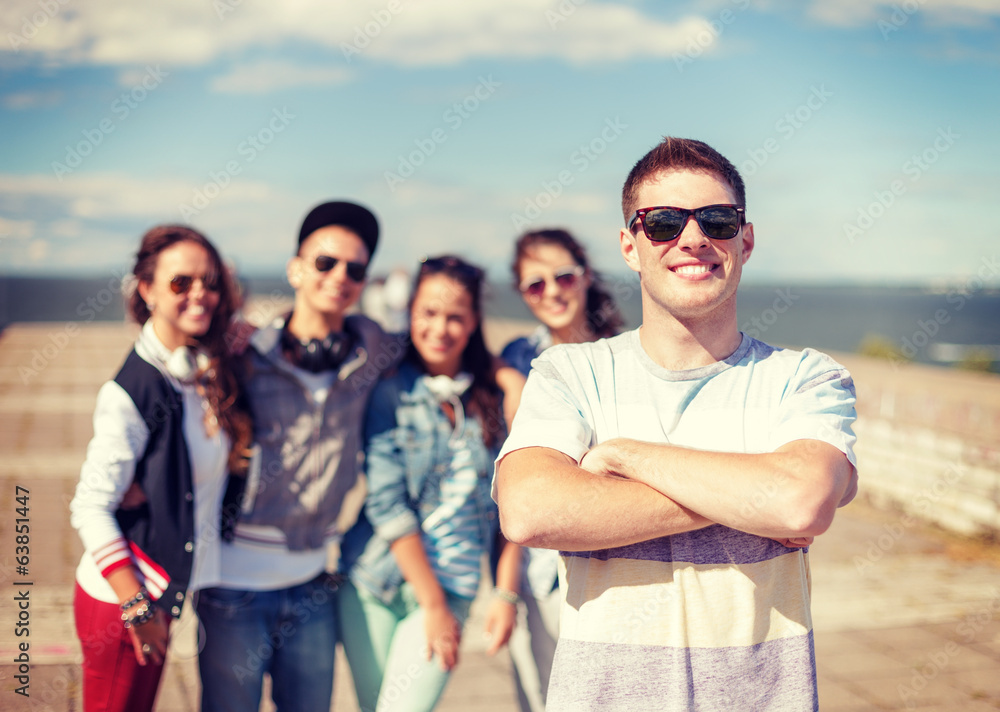 teenage boy with sunglasses and friends outside teenage boy with sunglasses and friends outside