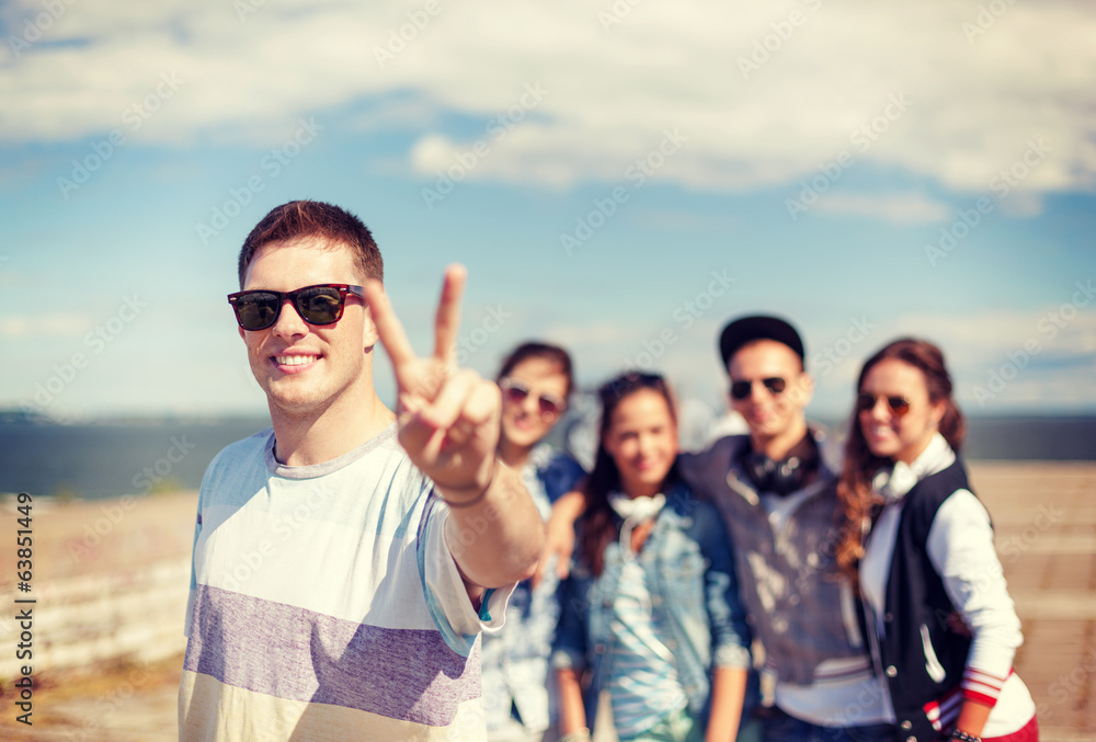 teenage boy with sunglasses and friends outside teenage boy with sunglasses and friends outside
