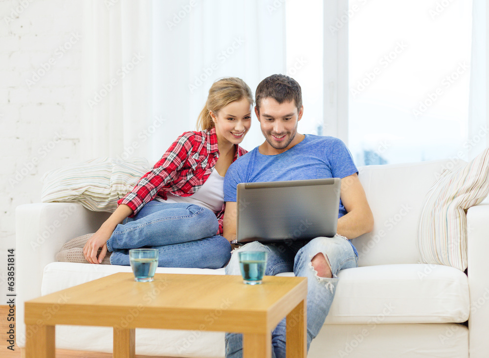 smiling couple with laptop computer at home smiling couple with laptop computer at home