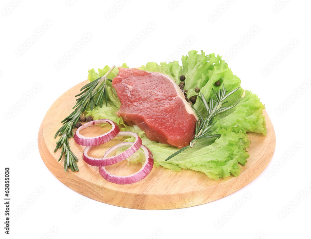 Raw beefsteak on platter.