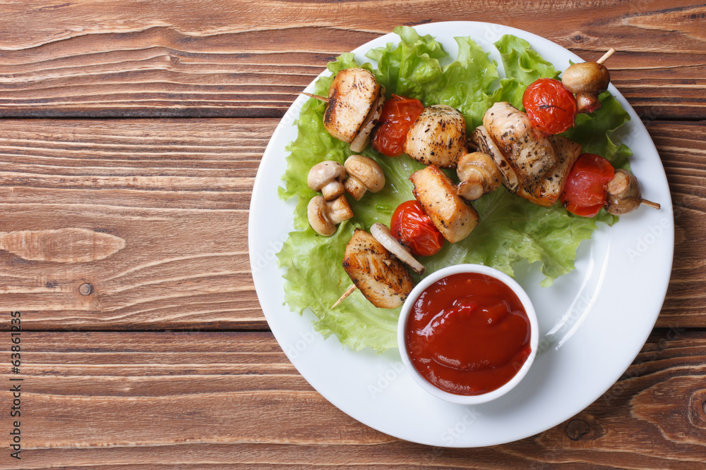 two fried chicken meat with vegetables top view