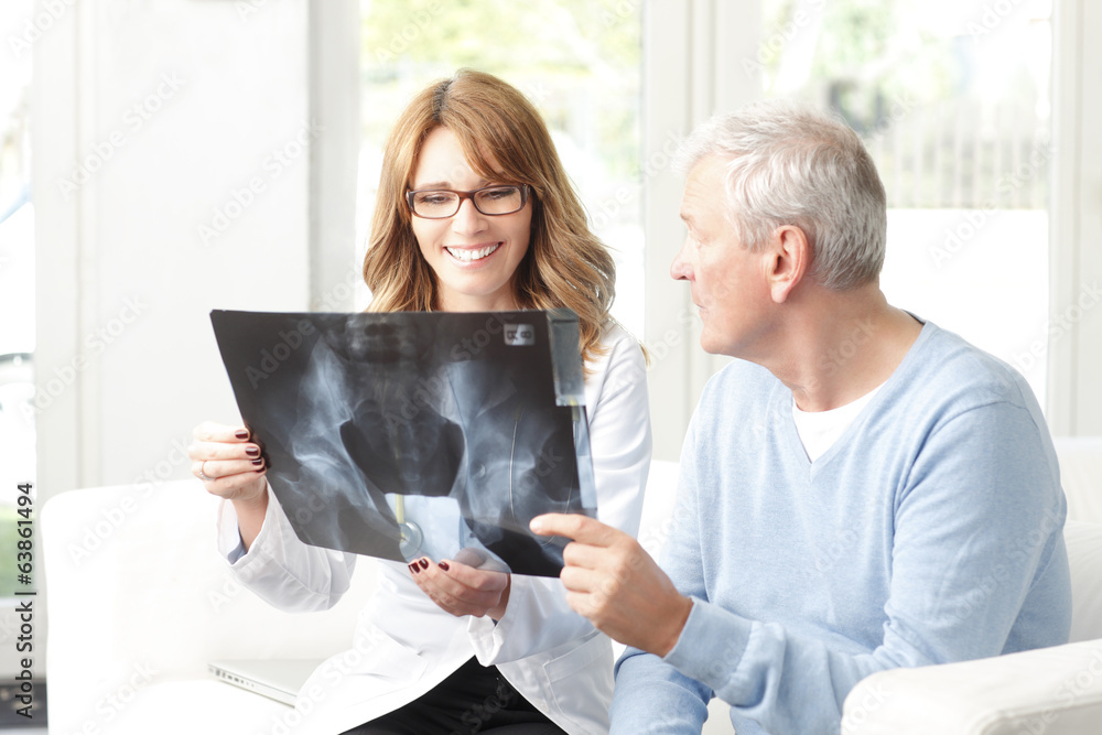 Happy female doctor consulting with senior patient Happy female doctor consulting with senior patient