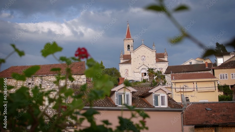 Panoramic view of the small Mediterranean town with a church Panoramic view of the small Mediterranean town with a church