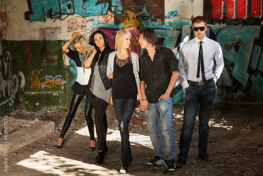 Naklejka premium Young people at abandoned apartment