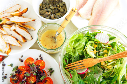 Salad with grilled meat, smoked fish and different vegetables. photo