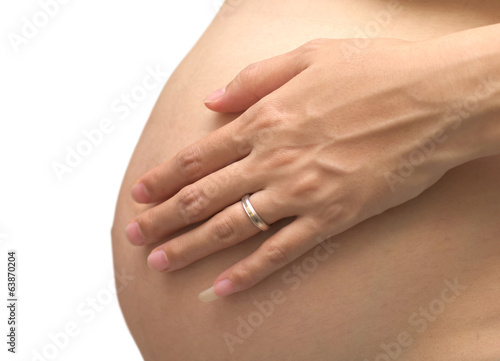 belly and hands of the pregnant woman